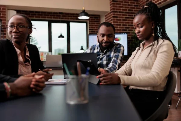 african-colleagues-brainstorming-ideas-office-using-laptop-tablet-create-online-presentation-with-data-research