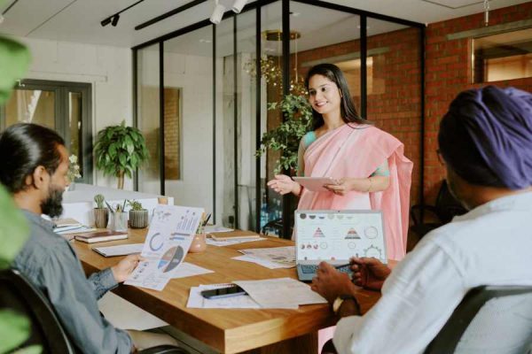 female-colleague-speaking-coworkers-1.jpg