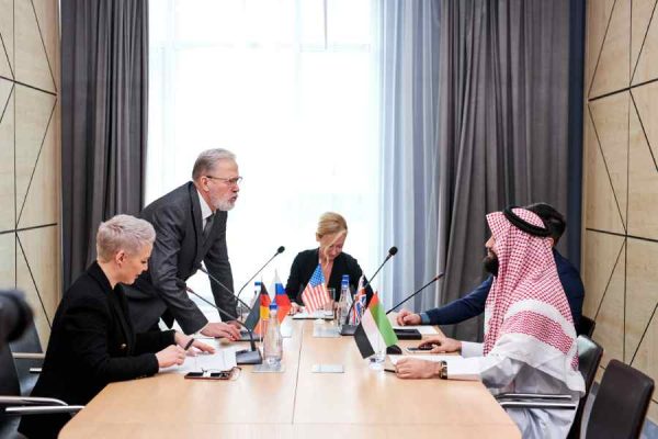 offers-his-plan-action-share-opinion-elderly-man-suit-talking-multi-ethnic-group-partners-sitting-desk-boardroom-discussing.jpg